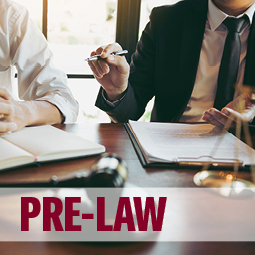 image of a lawyer and client talking over papers. text over image says "pre-law"