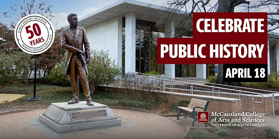 Statue on the University of South Carolina campus in front of a campus building with a banner reading “Celebrate Public History – April 18” and a badge marking the Public History Program’s 50th anniversary, McCausland College of Arts and Sciences.