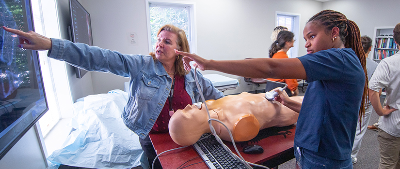 Student and instructor in a simulation lab