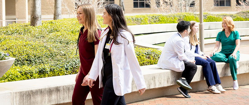 Students walking together on the plaza.