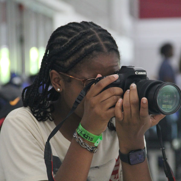 Female student using a camera
