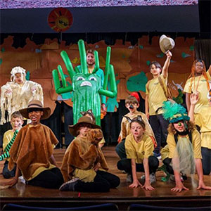Children in costume on stage