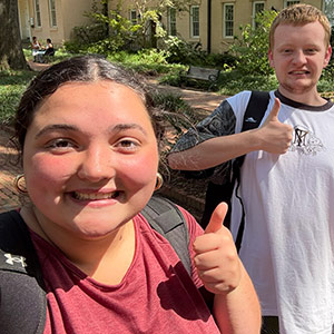 Corin Castro gives thumbs up with some of her mentees.