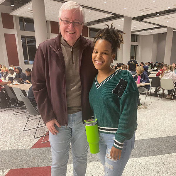Lacoya Lewis stands with USC president Michael Amiridis